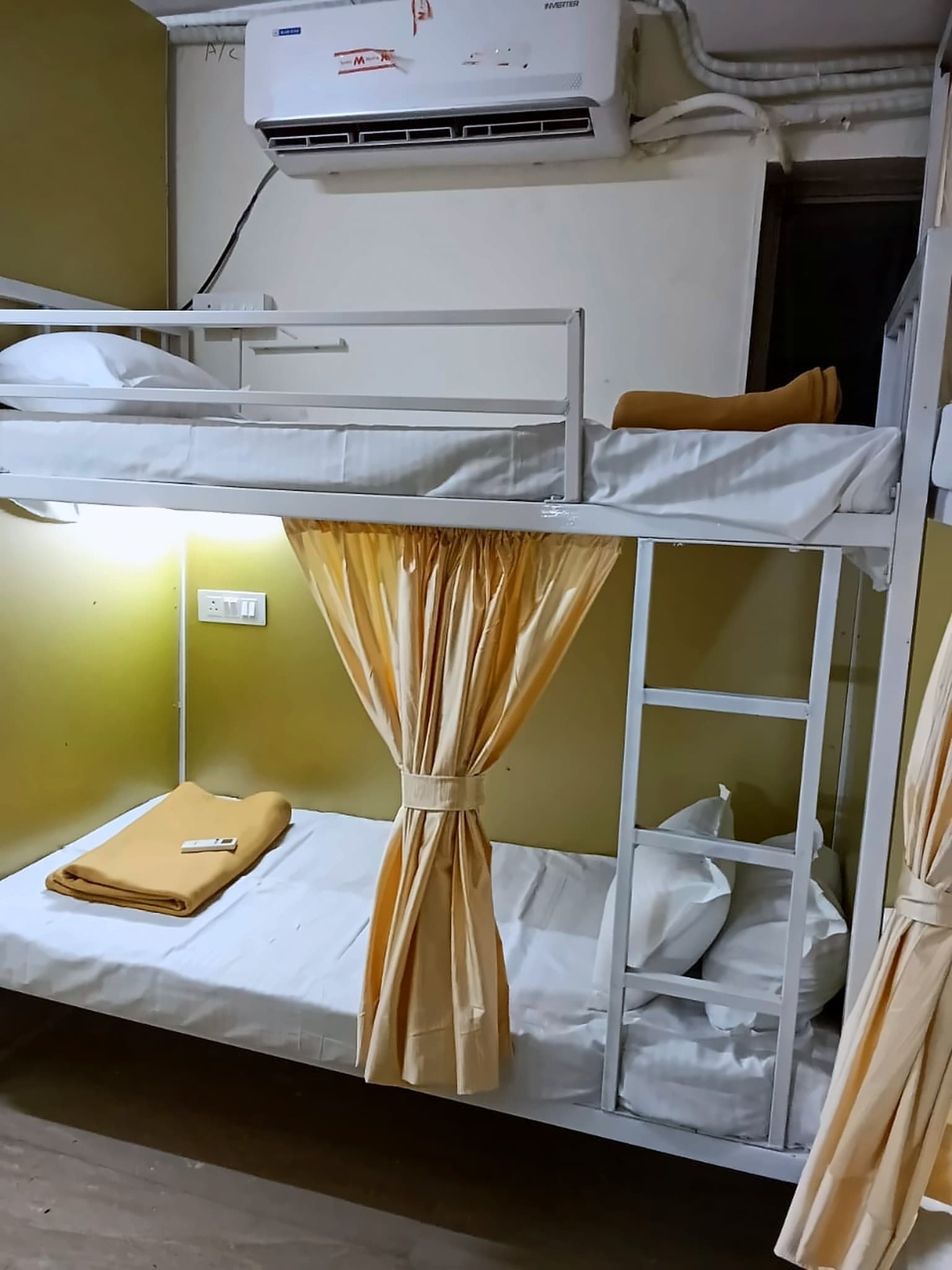 Bunk beds with privacy curtains, fresh linen and blankets