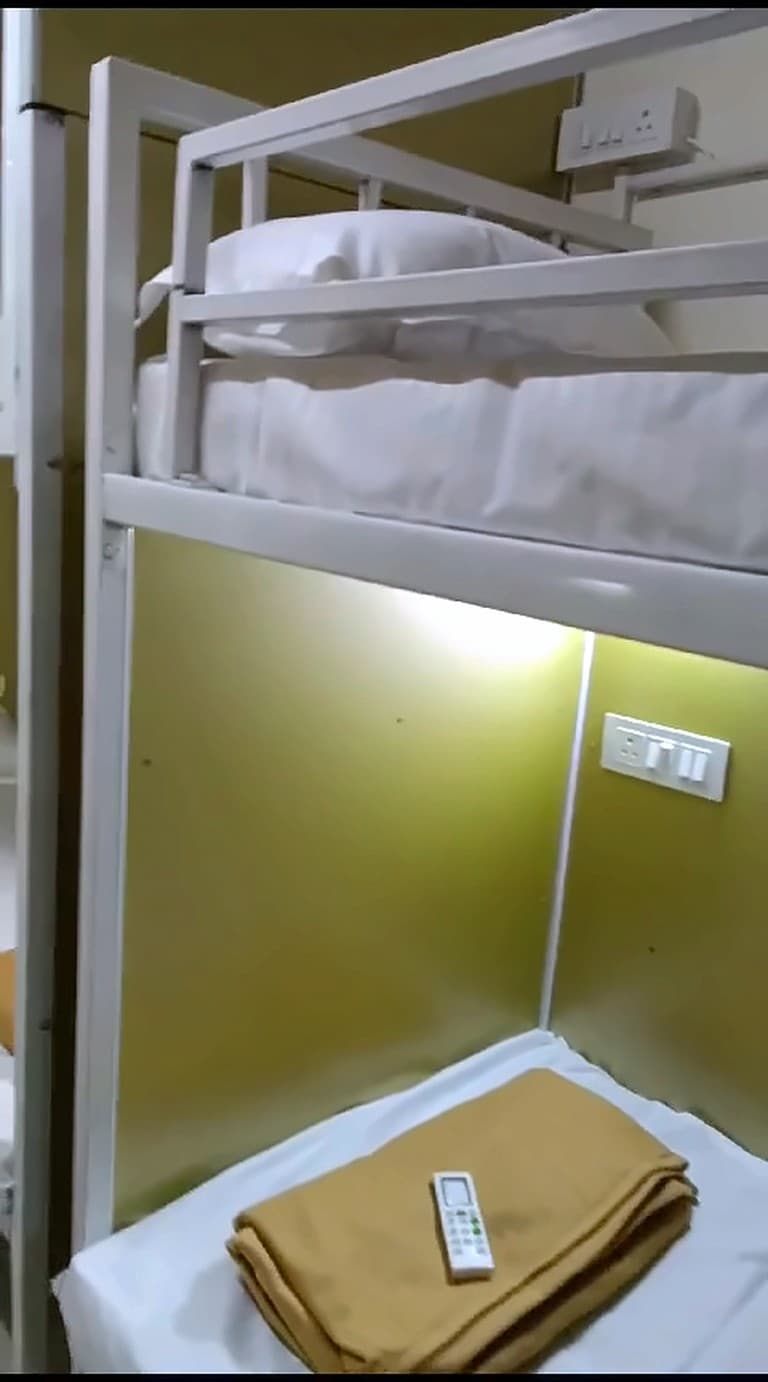 Lower berth with a reading light and socket panel